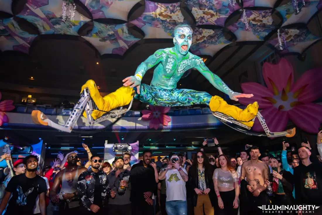 A performer above the crowd at Utopia.